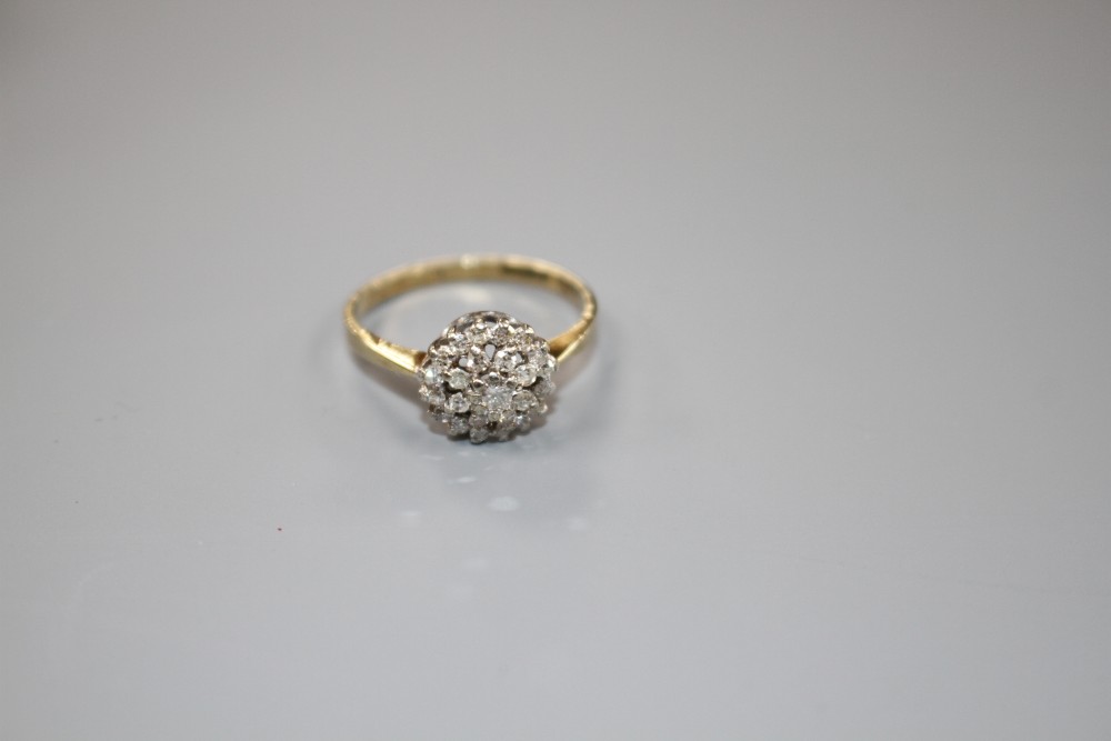 A modern 9ct gold and diamond cluster ring, size O, gross weight 2.2 grams.